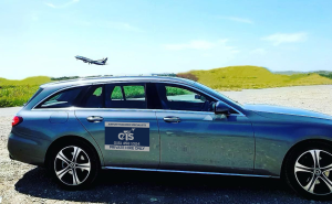 car-wih-plane-overhead CTS airport transfer service